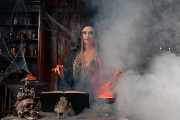 istock Halloween, witch use magic book and cauldron prepare poison or love potion 1387557265