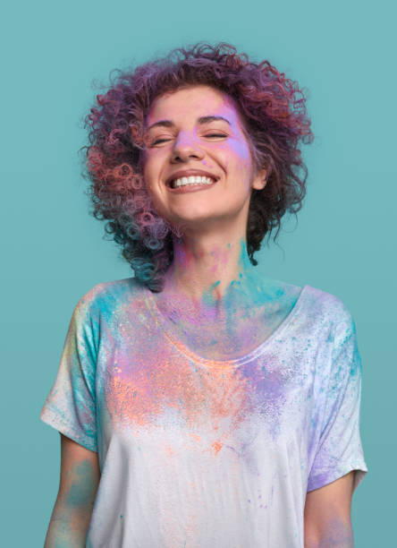istock Delighted woman in Holi paints in studio 1387557525