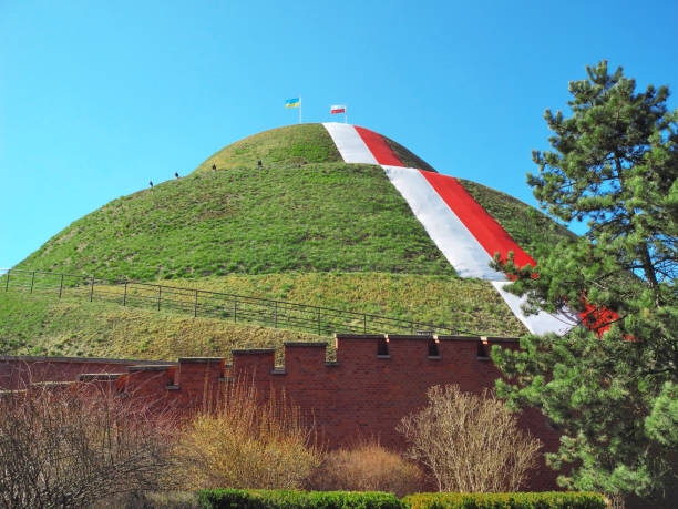 Kosciuszko Mound surrounded by defensive walls with the Polish flag spread on the slope
