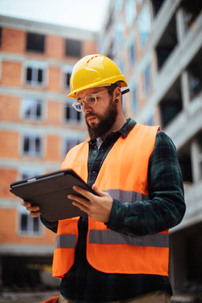 istock Controlling the whole building site from his tablet 1387565683