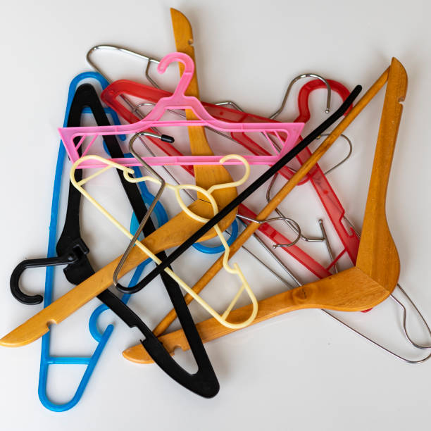 istock Mixed color hangers on white background 1387566328