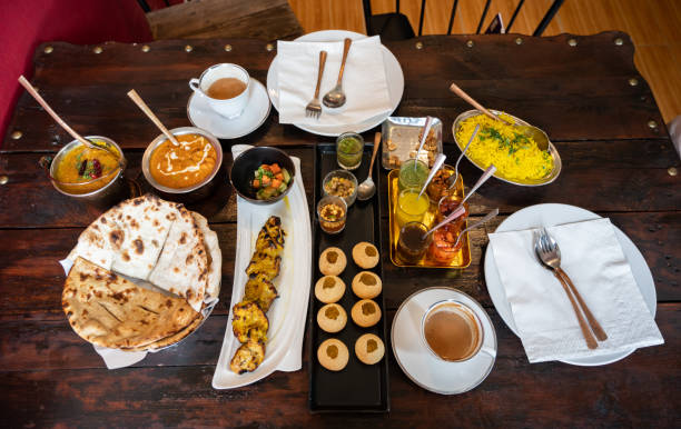 istock High angle view of assorted Indian food on the table. 1387567268
