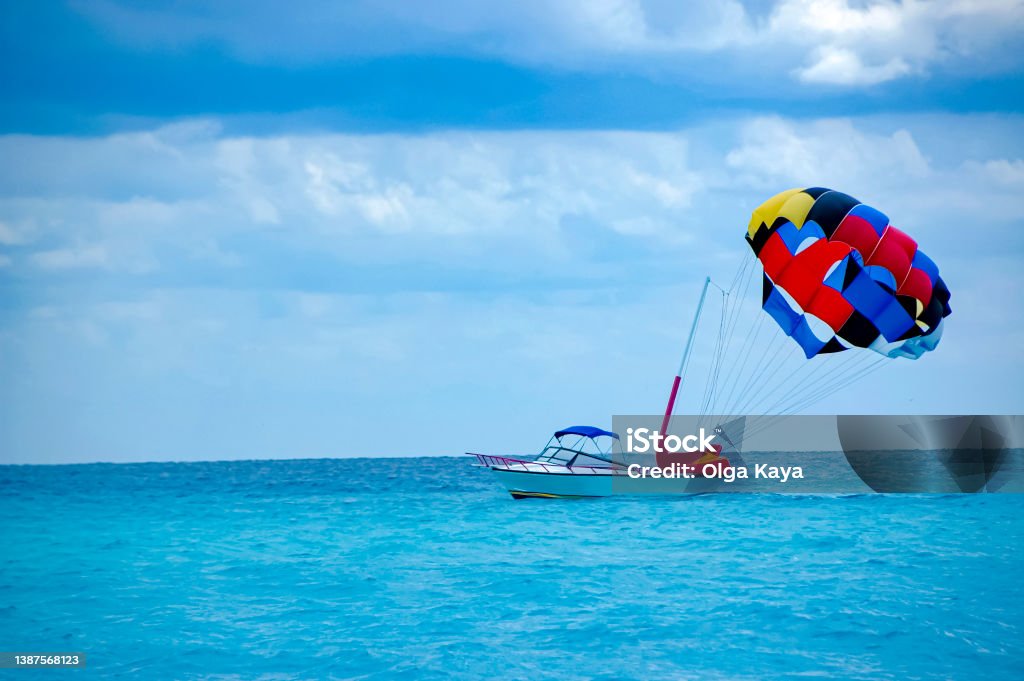Summer Summer boat on the blue waters Parasailing Stock Photo