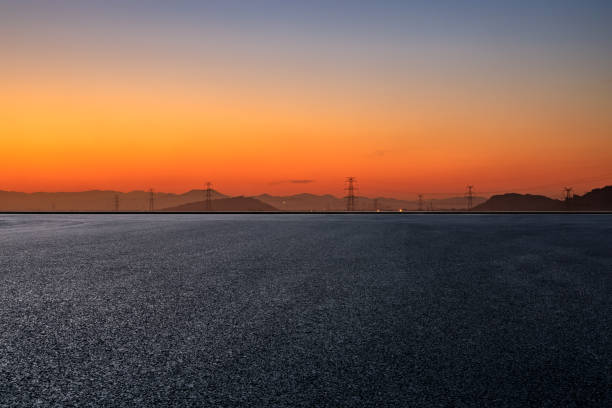 istock Asphalt road and mountain scenery at sunrise 1387568247