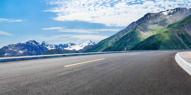istock Asphalt road and mountain landscape 1387570278