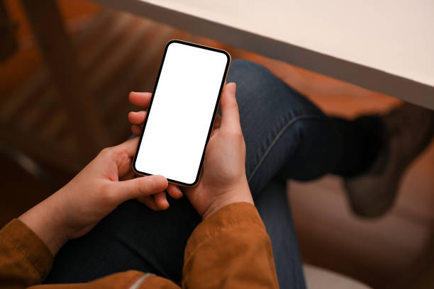 istock A hipster girl using smartphone at her table. 1387570373