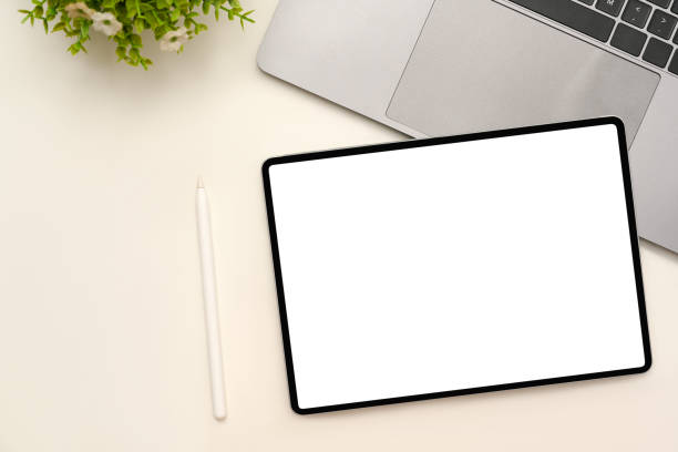 istock Modern office desk with touchpad mockup and stylus pen 1387570409