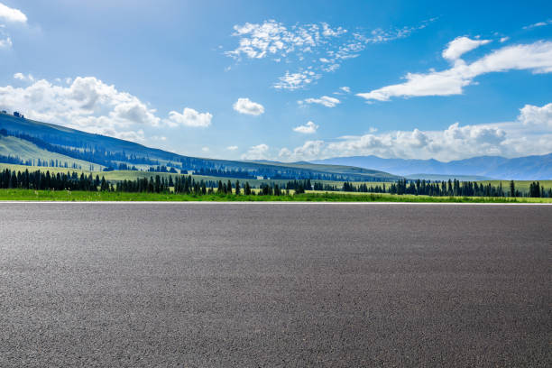 istock Asphalt road and green mountain nature landscape 1387575566