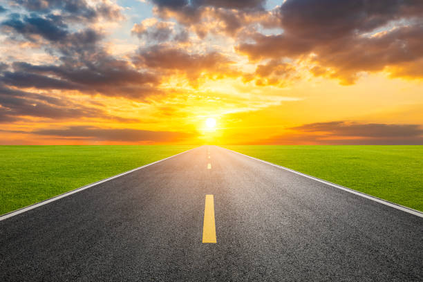 istock Asphalt road with beautiful sky clouds at sunset 1387575576