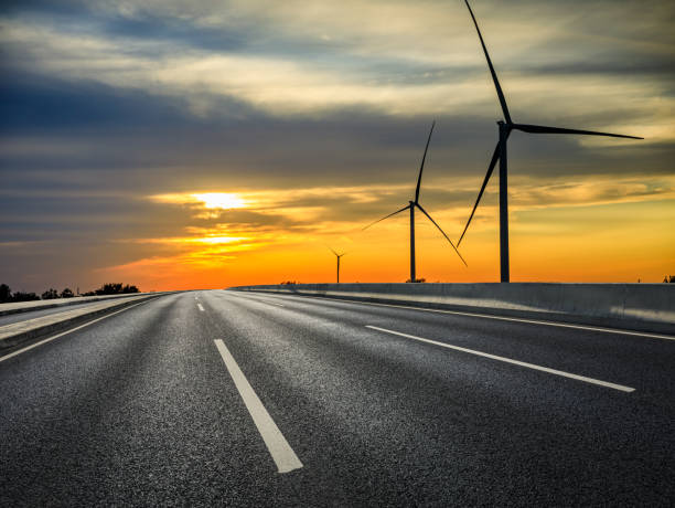 istock Asphalt road and colorful sky clouds at sunrise. 1387578488