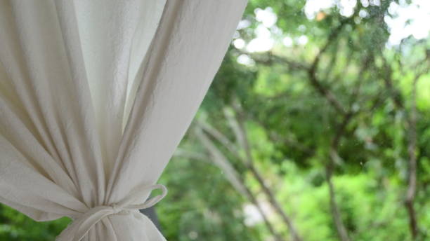 istock white curtain in the room with natural background 1387580942