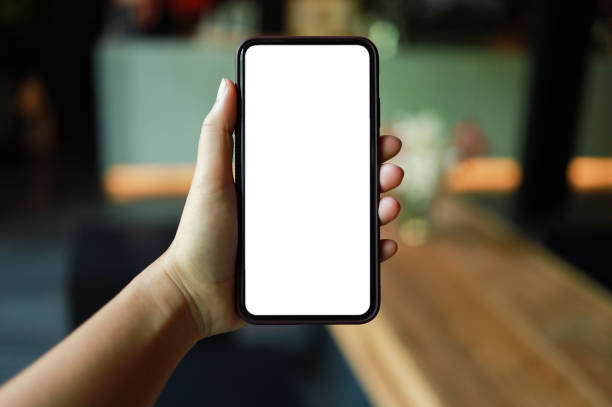 istock Women's hands holding cell telephone blank copy space screen. smart phone with technology concept 1387581839