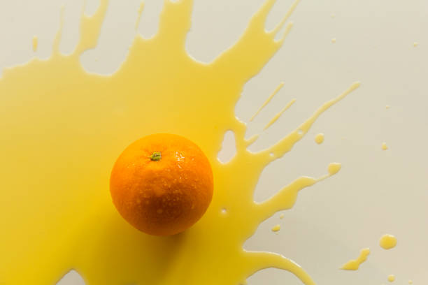 istock Creative photography, spilled orange juice 1387584203