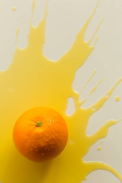 istock Spilled orange juice, creative photography 1387584955