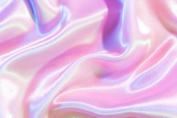 istock Light bright pink abstract texture.  iridescent surface wrinkled silk background 1387589057