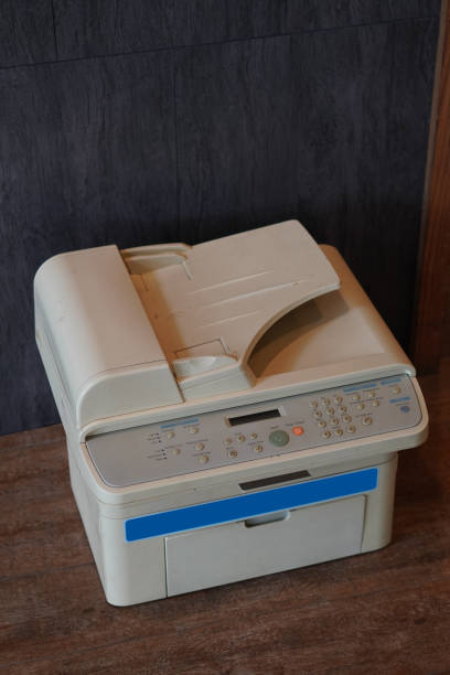 istock top view old white printer on wooden floor background,object background,technology background, copy space 1387593200