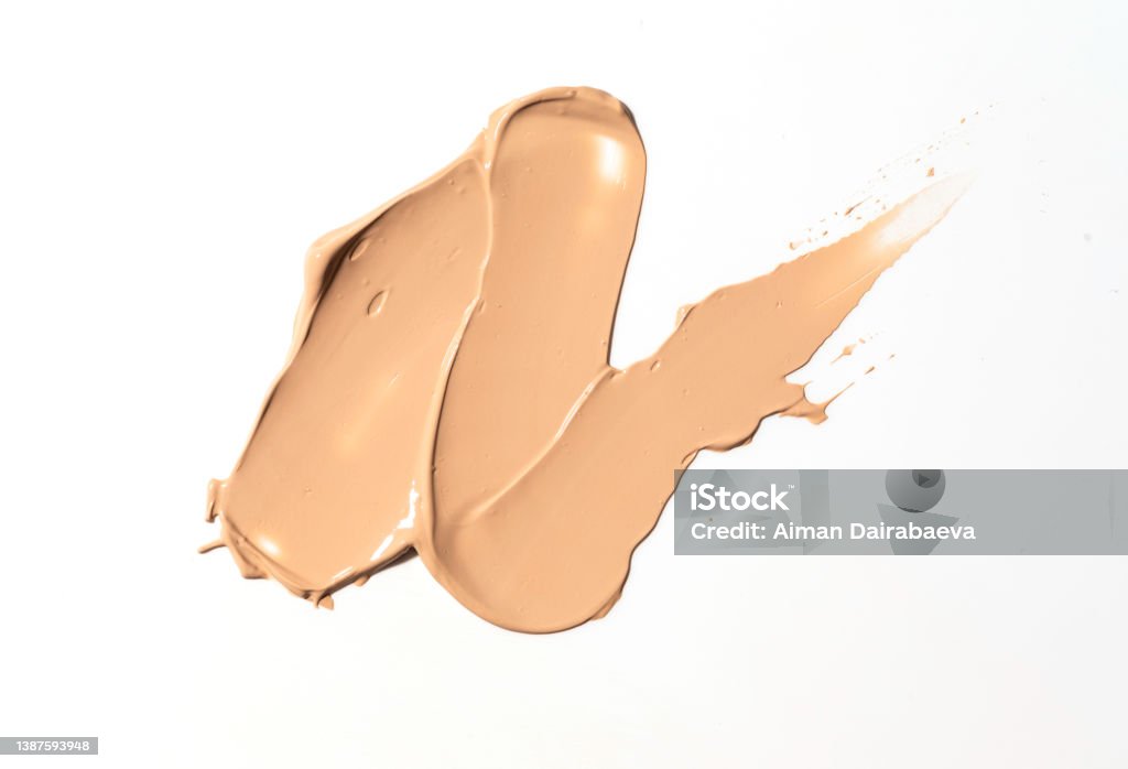 Creamy foundation smeared on white background. Isolated. Beauty and fashion conception. Creamy foundation smeared on white background. Isolated. Beauty and fashion conception. Liquid cream cosmetic, smudge texture Charitable Foundation Stock Photo
