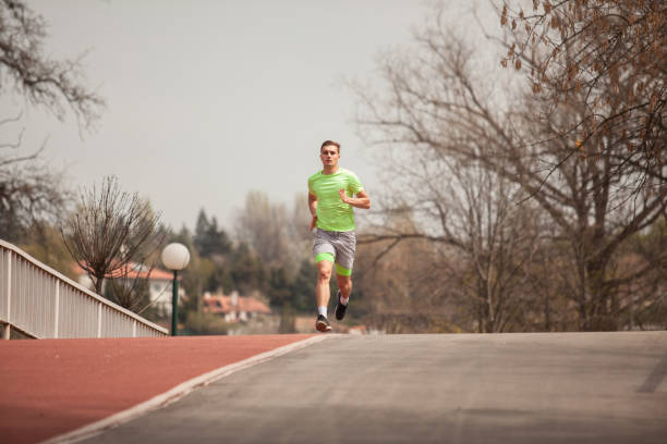 istock Running on the bridge towards the camera 1387606048
