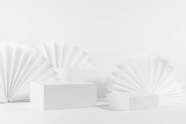 istock Fashion white abstract scene with set of three different size  rectangle podiums template for showing cosmetic product or goods with round oriental paper fans in asian style, side view, corner, 3d. 1387606963