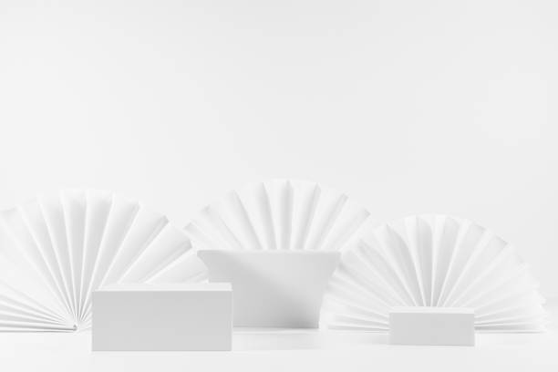 istock Three white rectangle podiums template with soft light semicircle paper fans as modern minimal stage mockup for showing, presentation cosmetic product, advertising, design, front view, copy space. 1387607056