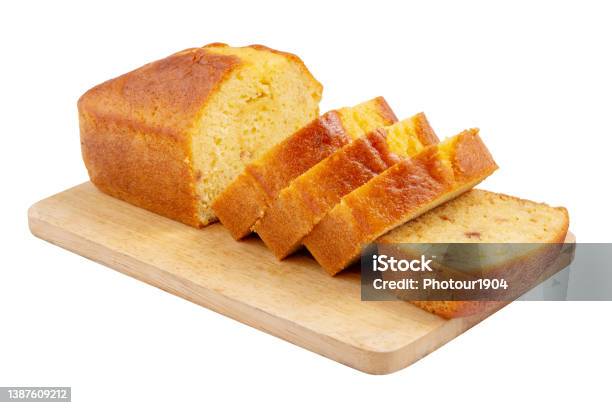 Sliced Pound Cake With Lemon Glaze On A Cutting Board Isolated On A White Background Stock Photo - Download Image Now