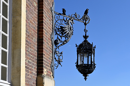 Nordkirchen, Germany, March 18, 2022 - Historic street lantern at Nordkirchen Castle / College of Finance (FHF) North Rhine-Westphalia in Nordkirchen.