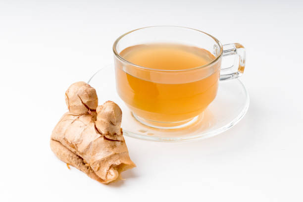 istock Ginger water and fresh ginger isolated on a white background. 1387611247