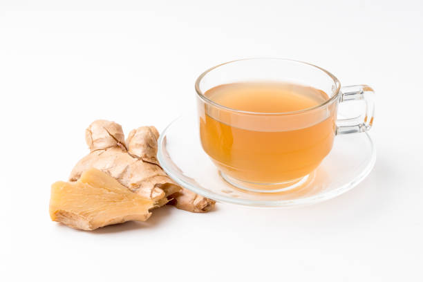 istock Ginger water and fresh ginger isolated on a white background. 1387611251