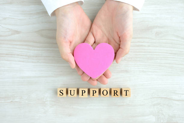 istock Human's hands with heart objcet and wooden blocks with 