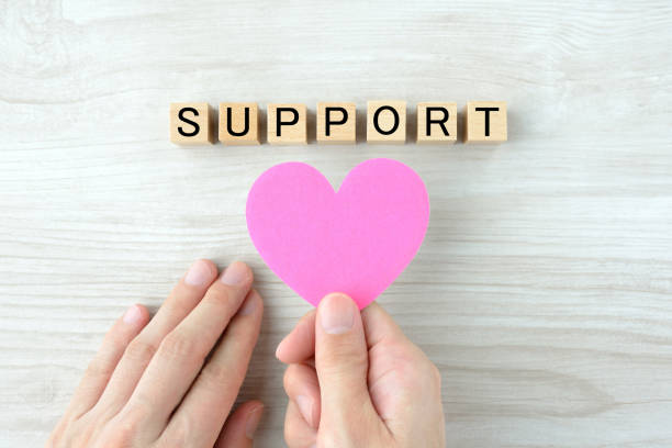istock Human's hands with heart objcet and wooden blocks with 