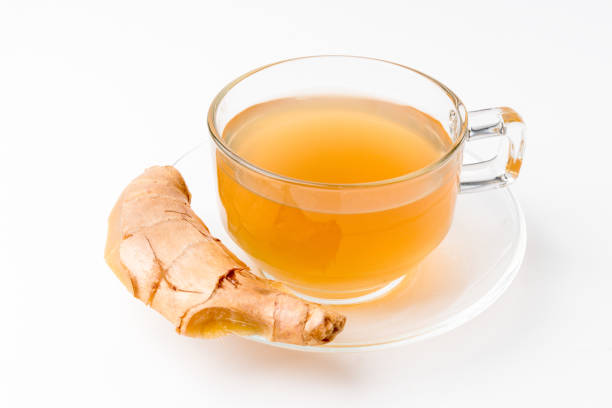 istock Ginger water and fresh ginger isolated on a white background 1387614029
