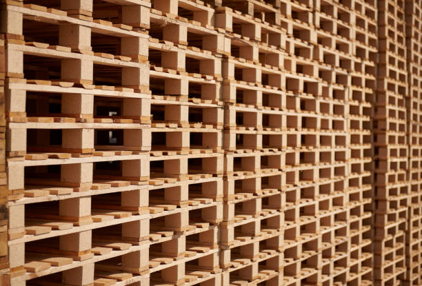 Stacked wooden pallets organized in a recycling center