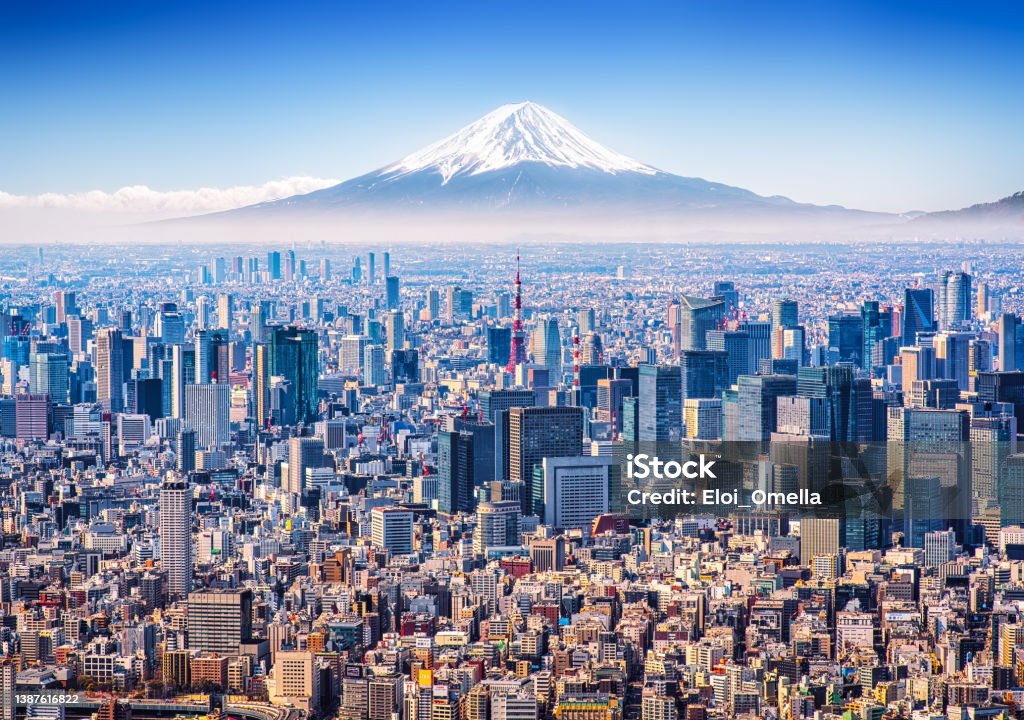 Tokyo Skyline with Mt. Fuji Aerial view of Mount Fuji, Tokyo Tower and modern skyscrapers in Tokyo on a sunny day. Tokyo - Japan Stock Photo