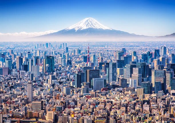 Tokyo Skyline with Mt. Fuji Aerial view of Mount Fuji, Tokyo Tower and modern skyscrapers in Tokyo on a sunny day. japan stock pictures, royalty-free photos & images