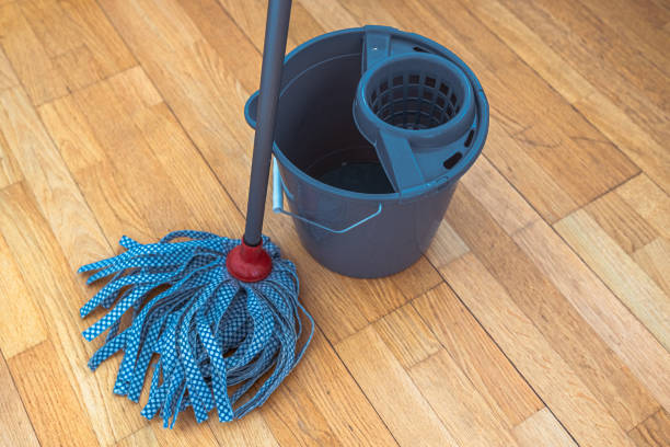 istock Cleaning parquet floor with rope mop 1387617022