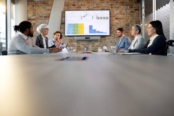 istock Business team talking on a meeting in a modern office. 1387620556