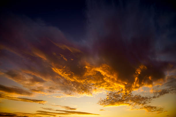 istock Sunrise with orange clouds over the mountains 1387620925