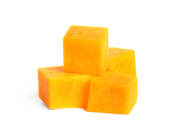 istock Pieces of ripe orange pumpkin on white background 1387620975