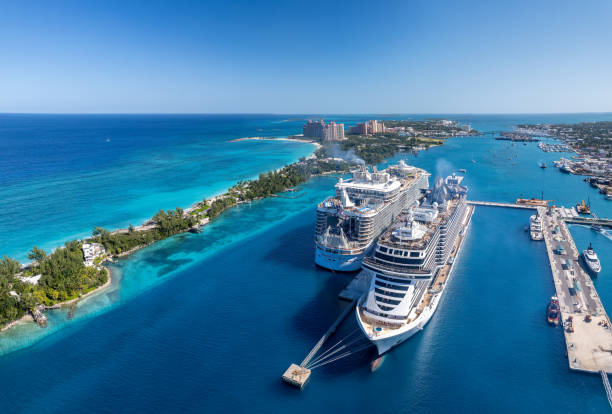 The drone aerial view of Paradise Island and Nassau port, Bahamas. Nassau, Bahamas- December 28,2021: The drone aerial view of Paradise Island and Nassau port, Bahamas. atlantis bahamas stock pictures, royalty-free photos & images