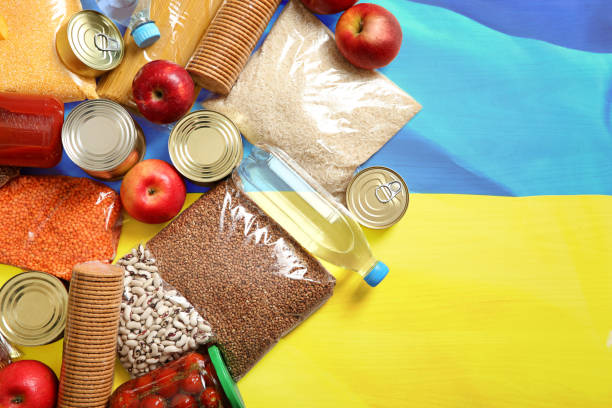 istock Many different products on Ukrainian flag, flat lay with space for text. Help during war 1387621040