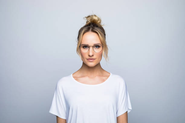 Confident beautiful blond woman wearing eyeglasses