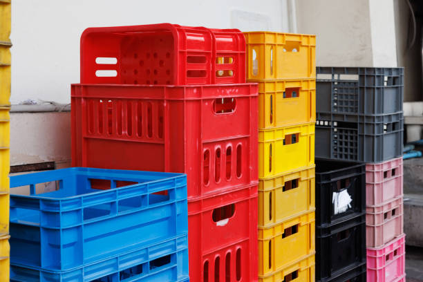 Stacks of empty plastic crates for storing and transporting goods in a warehouse