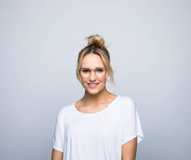istock Smiling beautiful blond woman wearing eyeglasses 1387627537