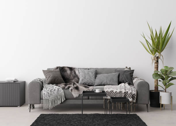 istock Empty white wall in modern living room. Mock up interior in contemporary, scandinavian style. Free, copy space for picture, poster, text, or another design. Sofa, table, plants. 3D rendering. 1387627621