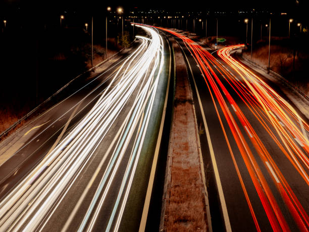 istock lights on the highway at night long exposure 1387627732