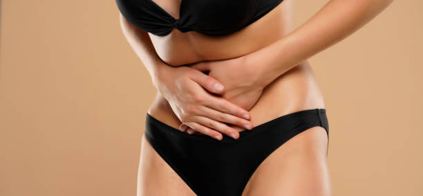istock Woman Suffering From Stomach Ache 1387628792