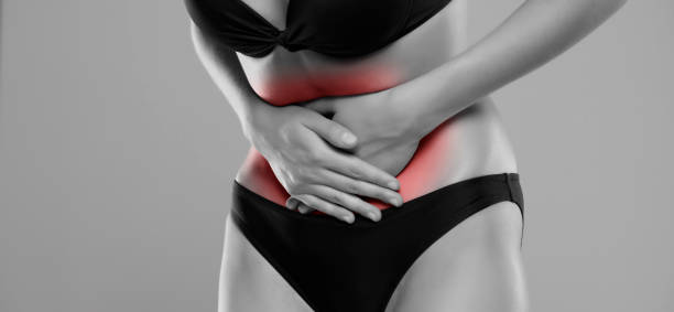 istock Woman Suffering From Stomach Ache 1387628872