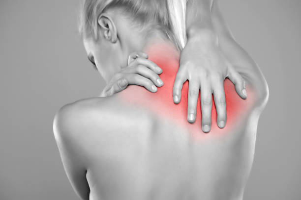 istock Woman with neck pain 1387628874