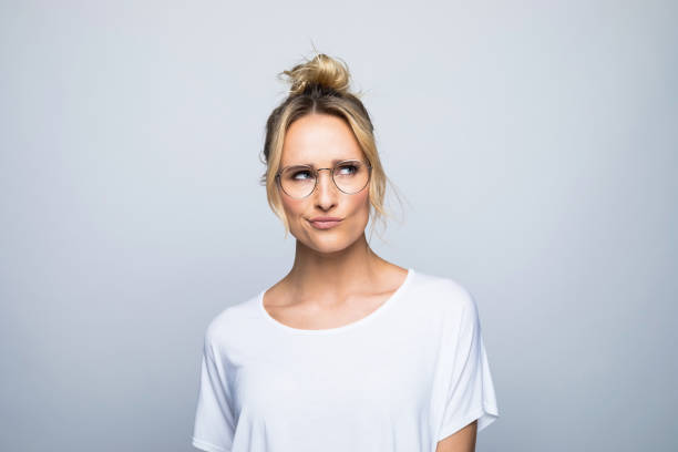 istock Thoughtful woman puckering while looking away 1387628923