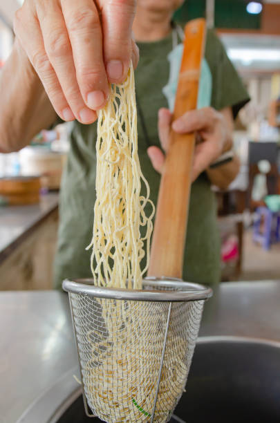 istock Egg noodles are about to be boiled to make noodles. 1387629203